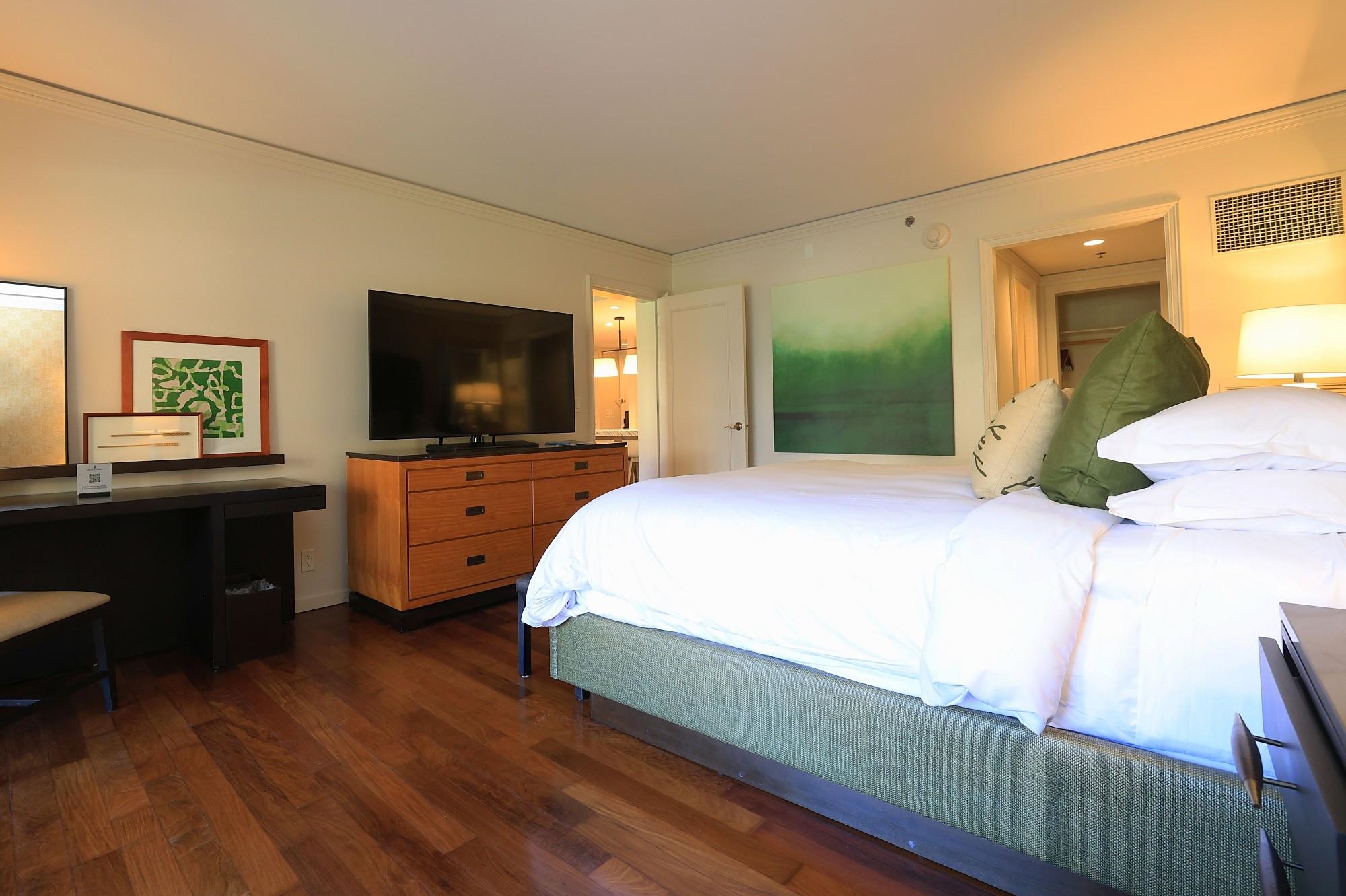 1 Ritz Carlton Drive, Unit 1502 Lahaina, HI 96761 - Photo 20 of 47 a bedroom with a bed and a flat screen tv