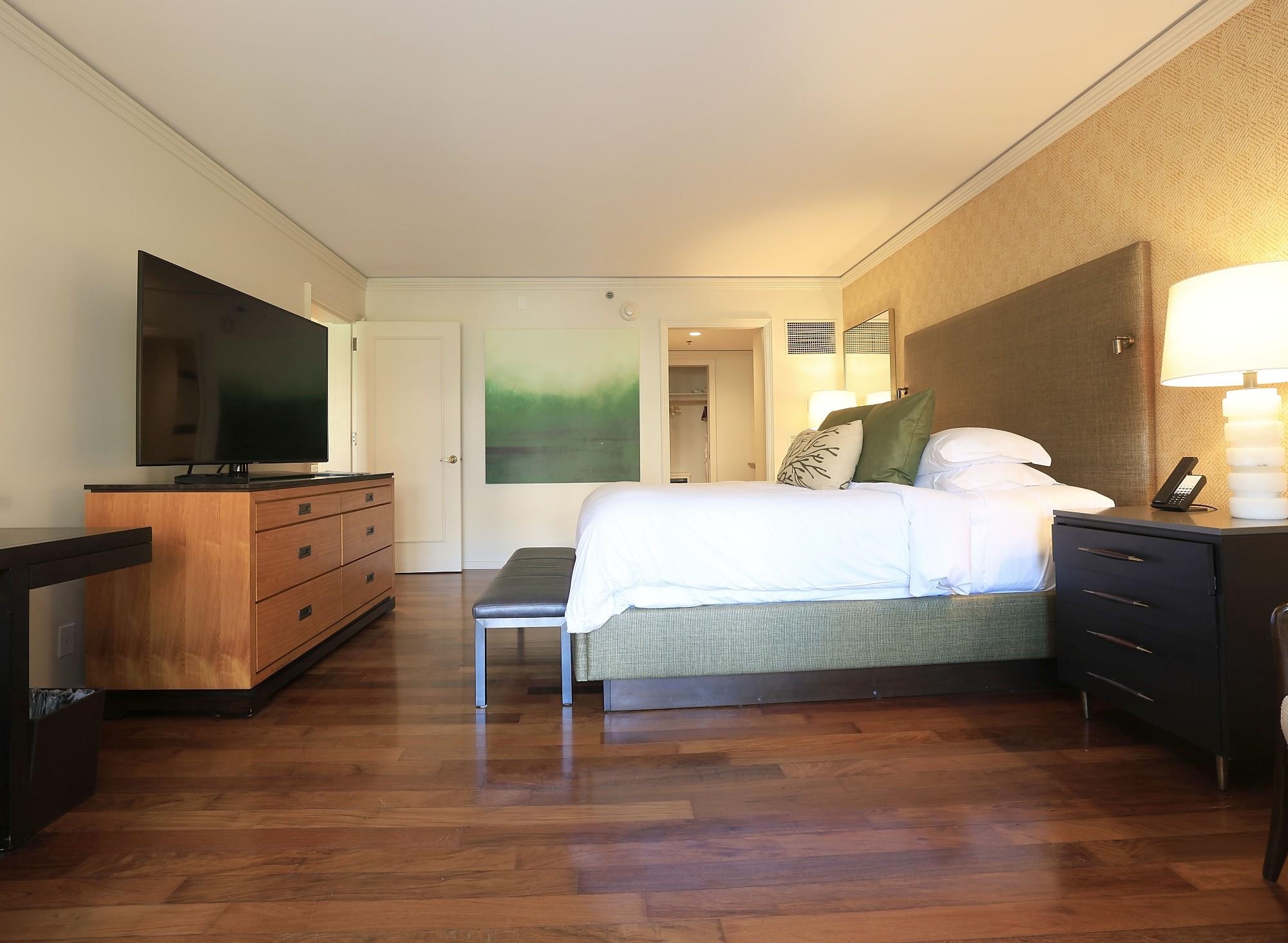 1 Ritz Carlton Drive, Unit 1502 Lahaina, HI 96761 - Photo 21 of 47 a bedroom with a bed and a flat screen tv