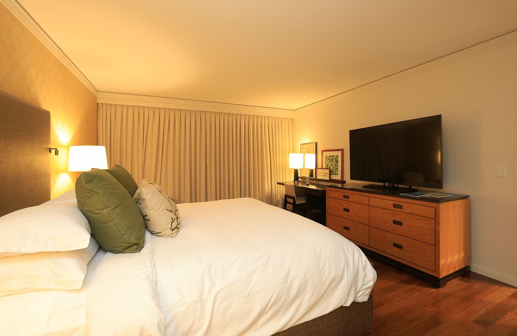 1 Ritz Carlton Drive, Unit 1502 Lahaina, HI 96761 - Photo 22 of 47 a bedroom with a bed and a flat screen tv