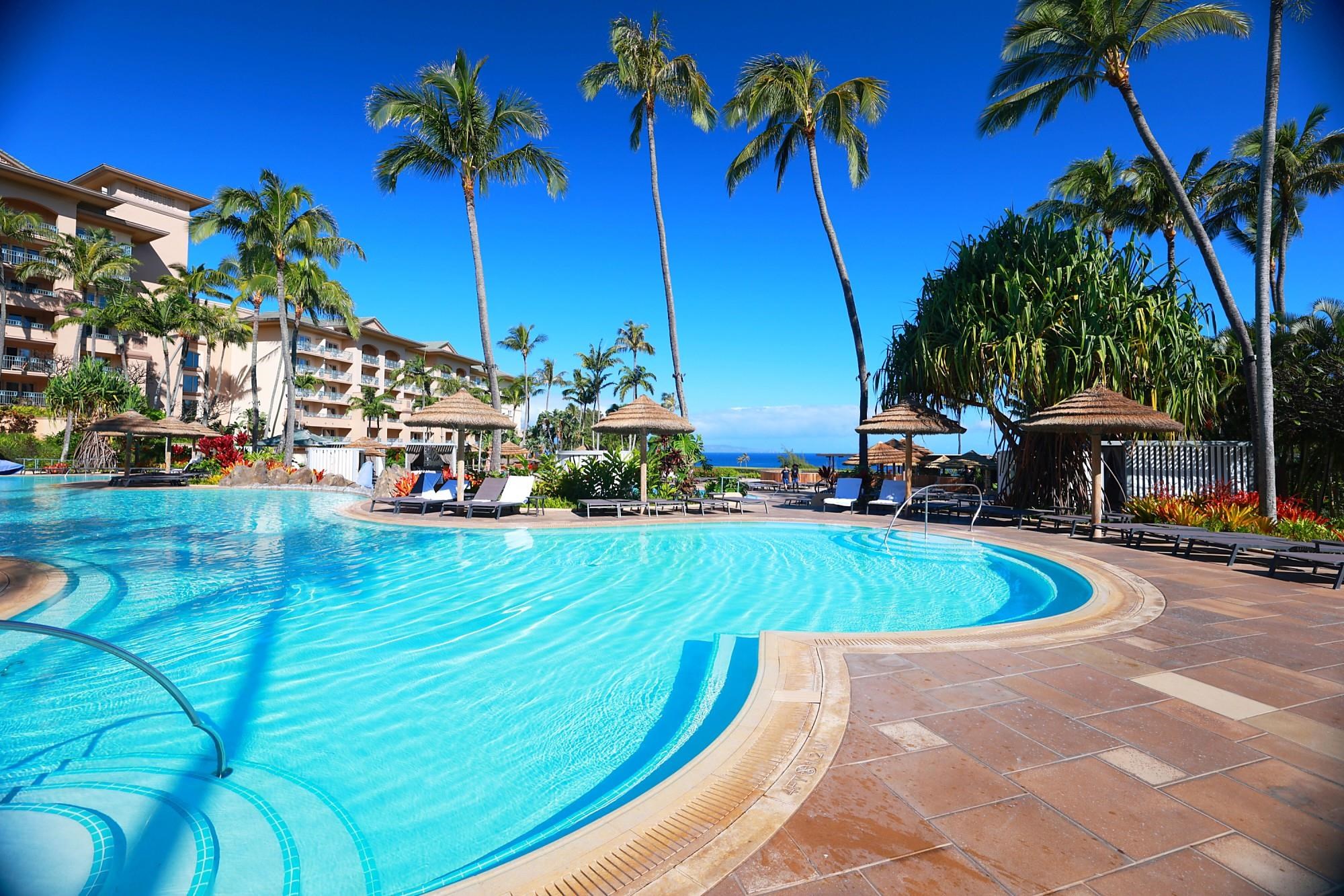 1 Ritz Carlton Drive, Unit 1502 Lahaina, HI 96761 - Photo 47 of 47 a view of a swimming pool with a yard and palm trees