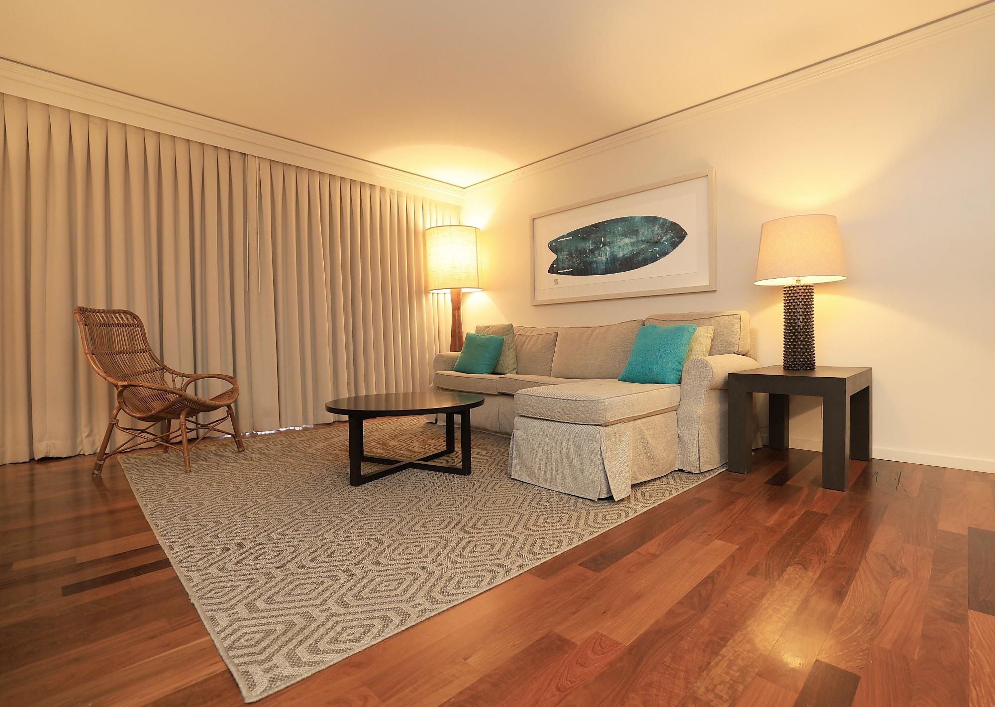 1 Ritz Carlton Drive, Unit 1502 Lahaina, HI 96761 - Photo 6 of 47 a living room with furniture and a lamp