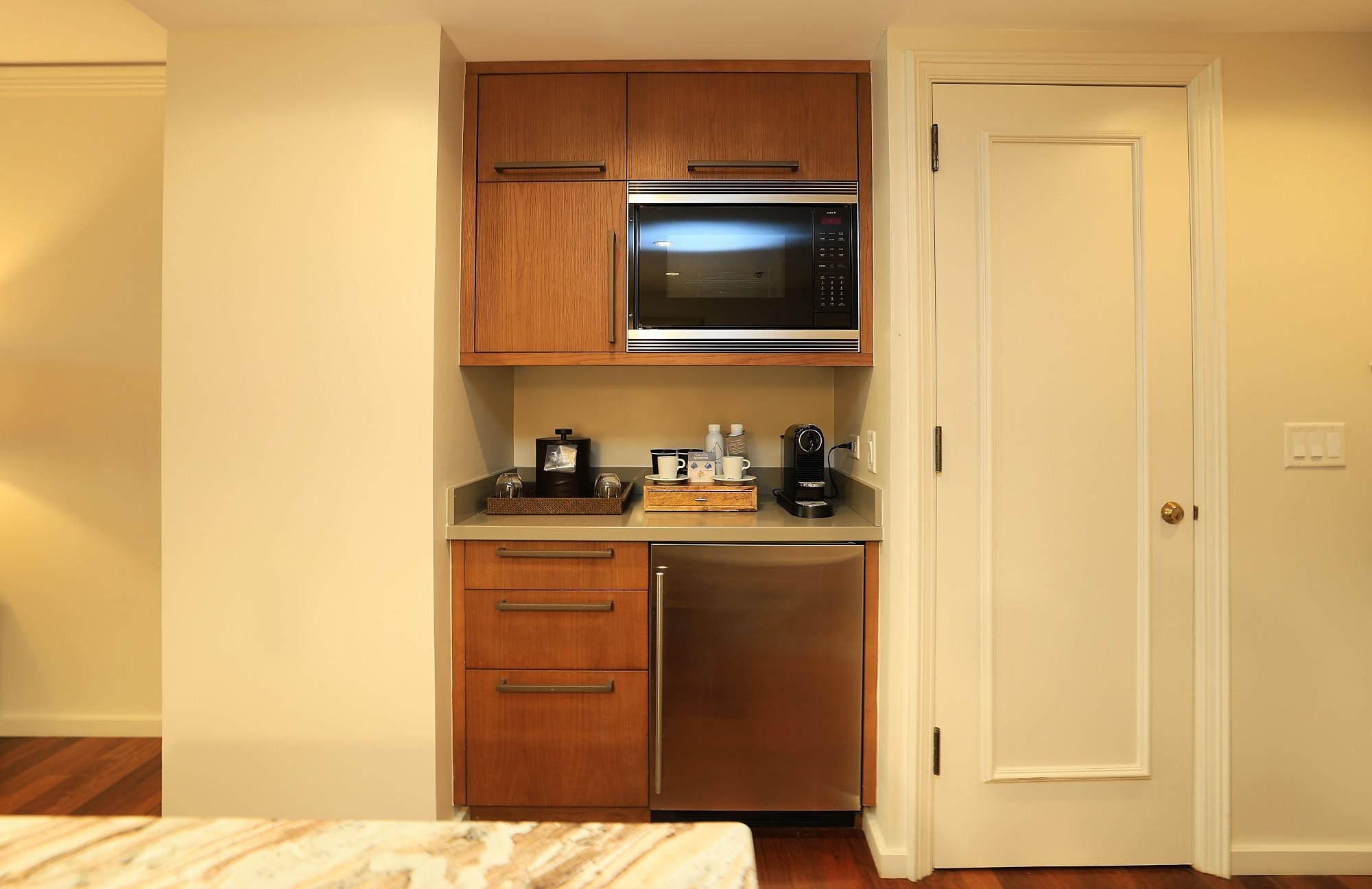 1 Ritz Carlton Drive, Unit 1502 Lahaina, HI 96761 - Photo 9 of 47 a kitchen with a sink and a microwave