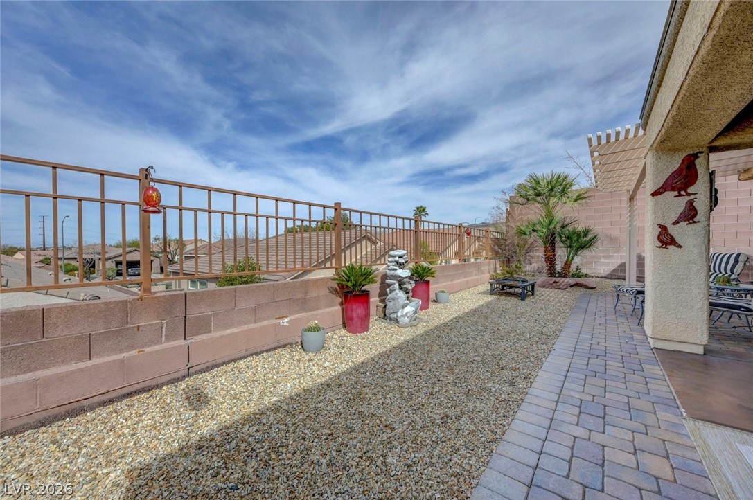 2700 Rue Montpellier Avenue Henderson, NV 89044 - Photo 32 of 39 Fenced backyard featuring a patio and an outdoor fire pit