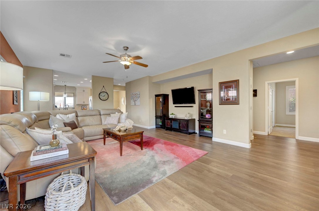 2700 Rue Montpellier Avenue Henderson, NV 89044 - Photo 9 of 39 Living room with light wood finished floors, ceiling fan, and recessed lighting