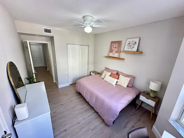 a bedroom with a bed and a chair