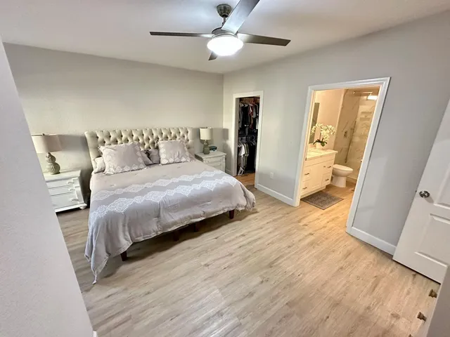 a bedroom with a bed and a walk in closet