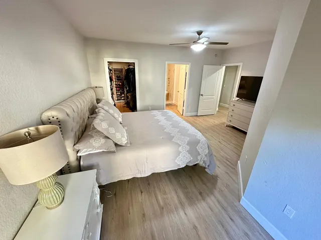 a bedroom with a bed and a mirror