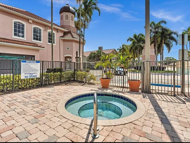 a view of a swimming pool with a patio
