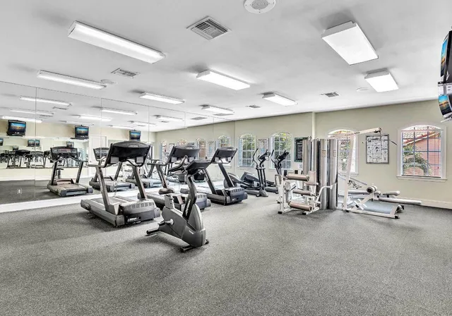 a view of a park with iron fence