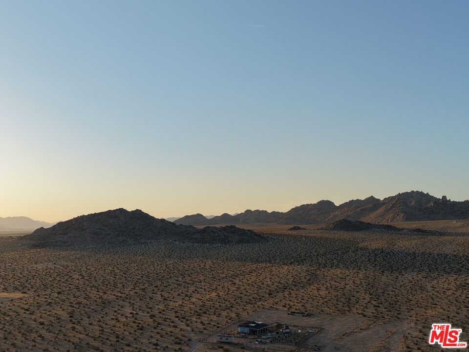 10424 Santa Fe Fire Road Lucerne Valley, CA 92356 - Photo 20 of 33 a view of a house with a mountain