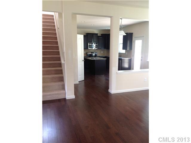 78054 Rillstone Drive Lancaster, SC 29720 - Photo 4 of 11 a view of a hallway view with wooden floor and staircase