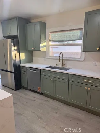 a kitchen with a sink and cabinets