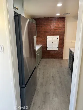 a view of a refrigerator in a kitchen