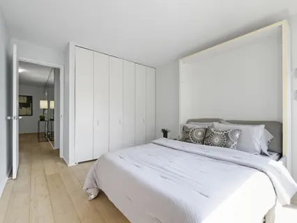 a bedroom with a bed and a view of bedroom