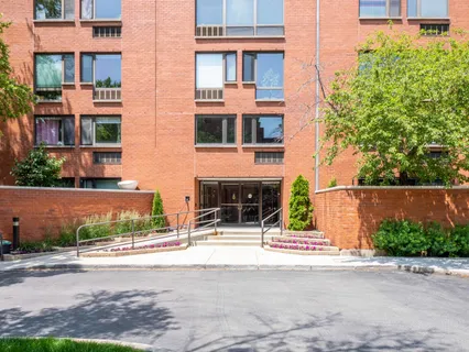 a view of a building with a street