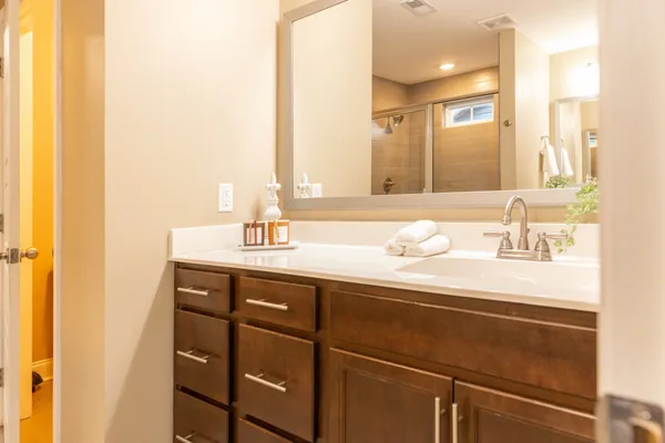 a bathroom with a sink and a mirror