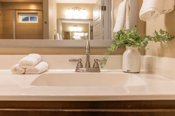 a bathroom with a sink and a mirror