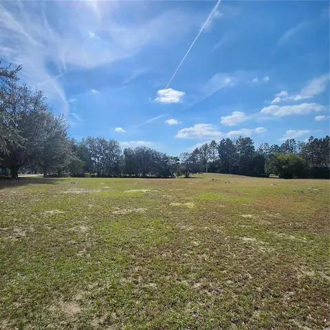 a view of an ocean and a yard