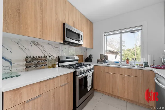 a kitchen with a stove and a microwave
