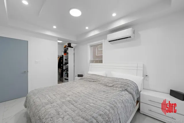 a bedroom with a bed and a closet