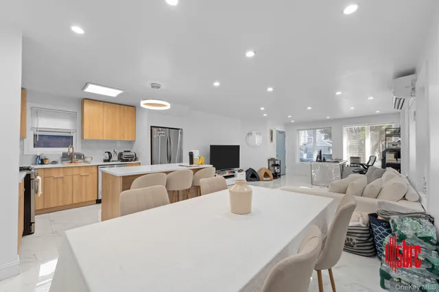 a large kitchen with a table and chairs