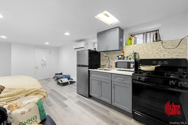 a kitchen with a sink appliances and cabinets
