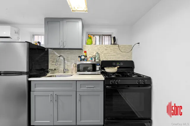 a kitchen with a stove and a refrigerator
