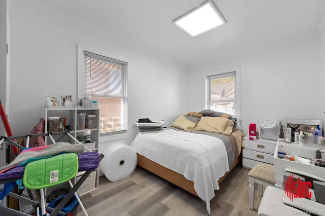 a bedroom with a bed and a chair