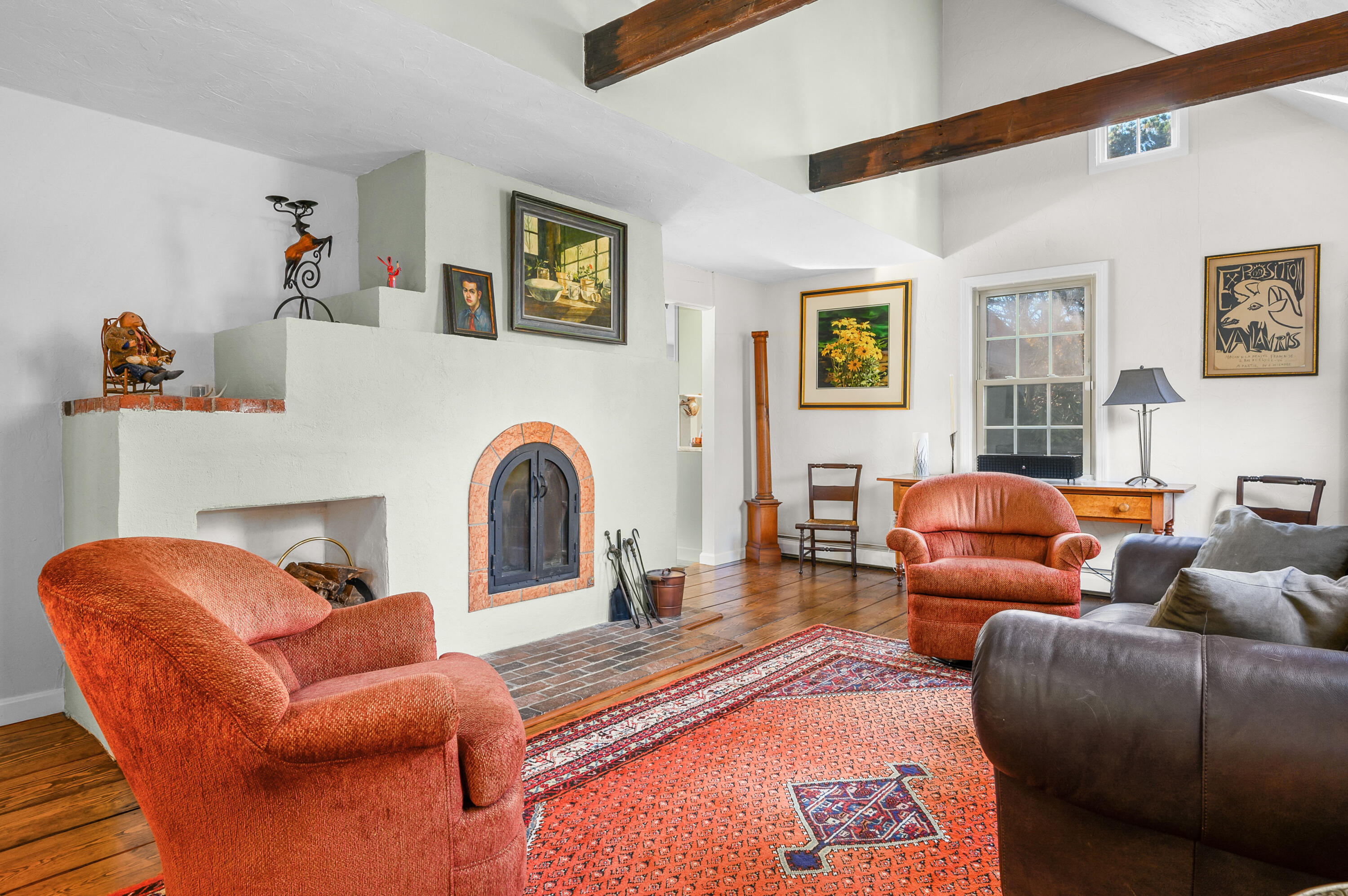523 Bumps River Road Osterville, MA 02655 - Photo 11 of 49 a living room with furniture a couch and paintings on the wall