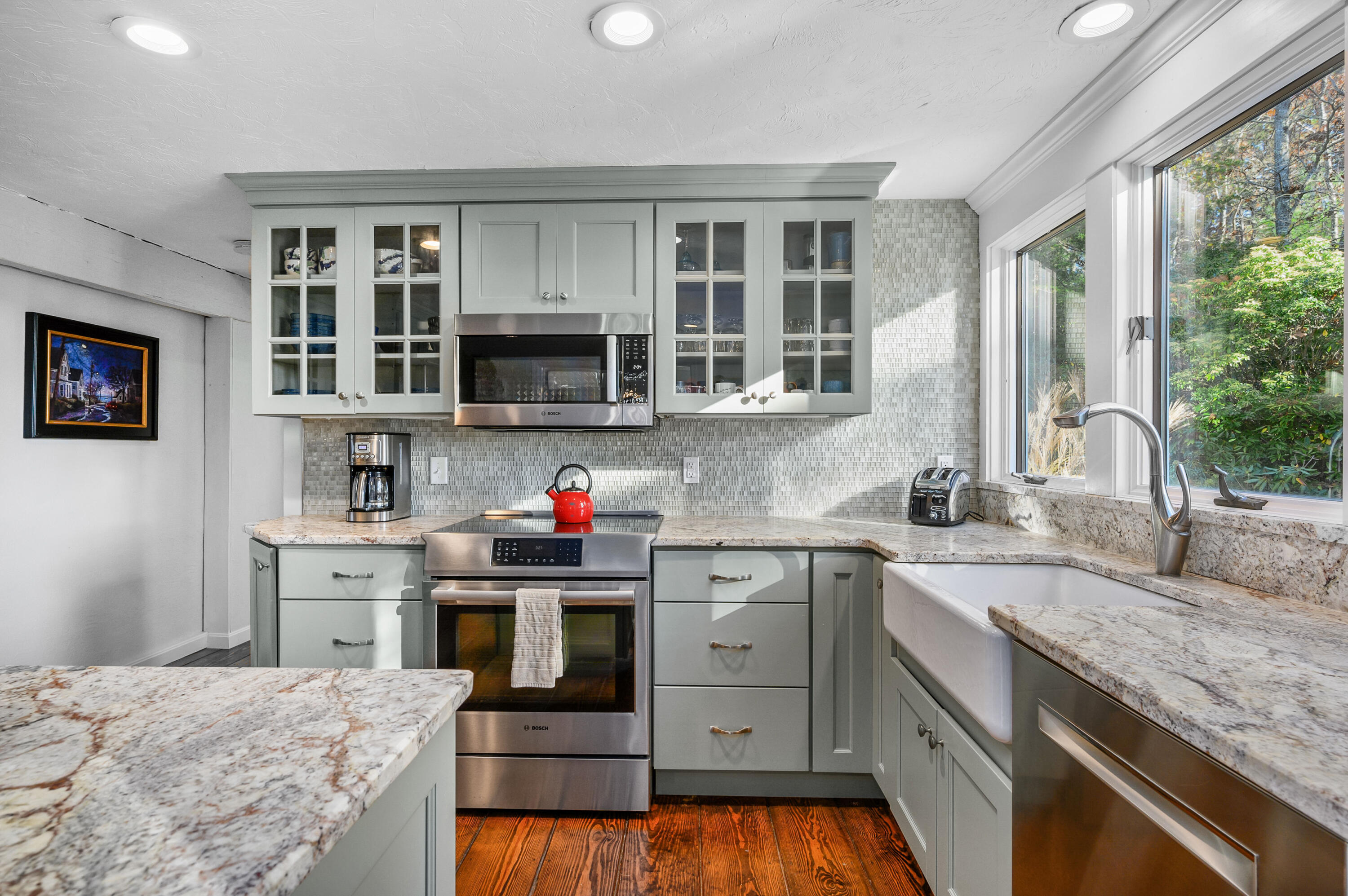 523 Bumps River Road Osterville, MA 02655 - Photo 14 of 49 a kitchen with kitchen island granite countertop a sink stainless steel appliances and cabinets