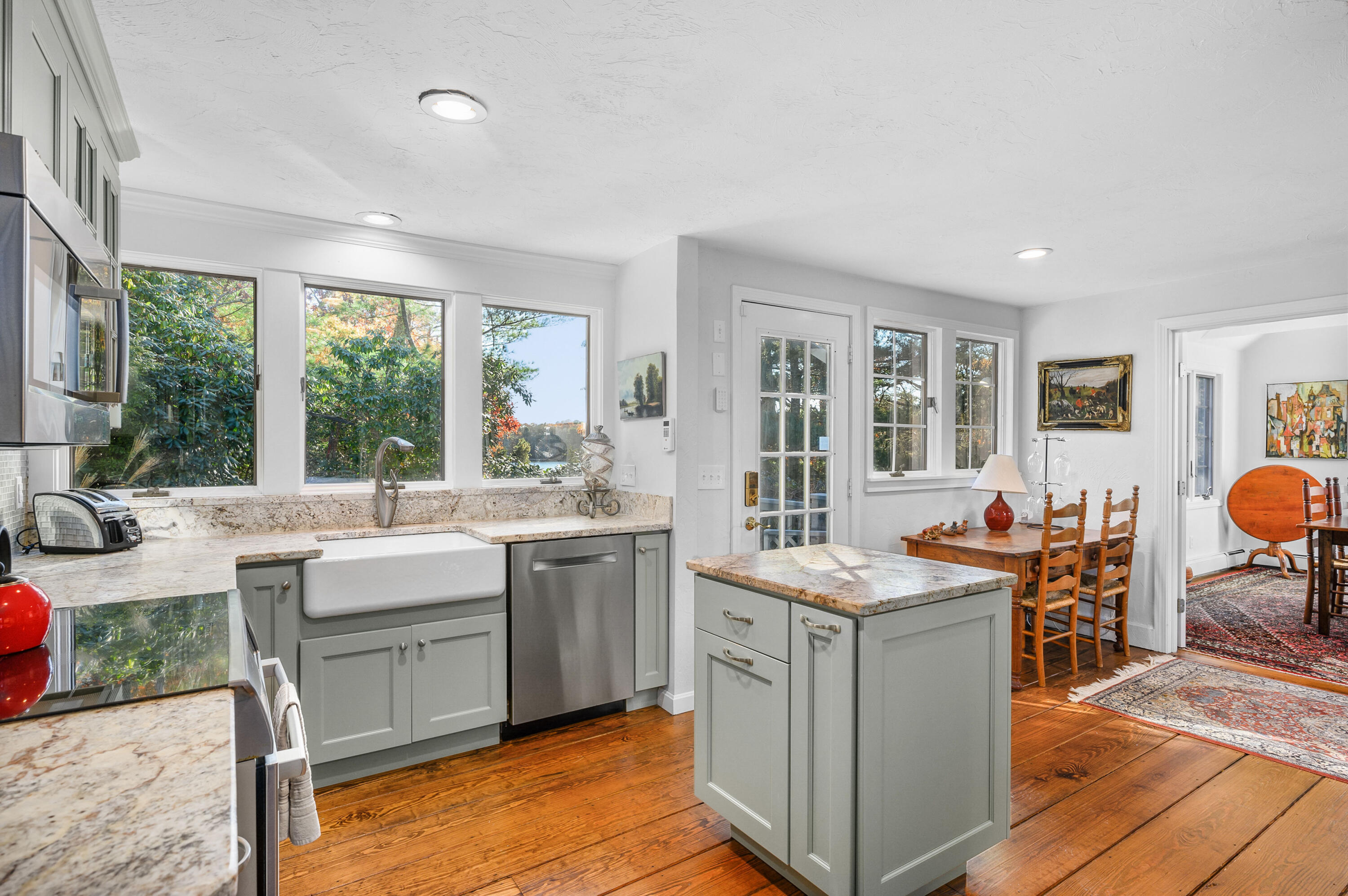 523 Bumps River Road Osterville, MA 02655 - Photo 16 of 49 a view of a kitchen with kitchen island granite countertop a sink and a stove top oven
