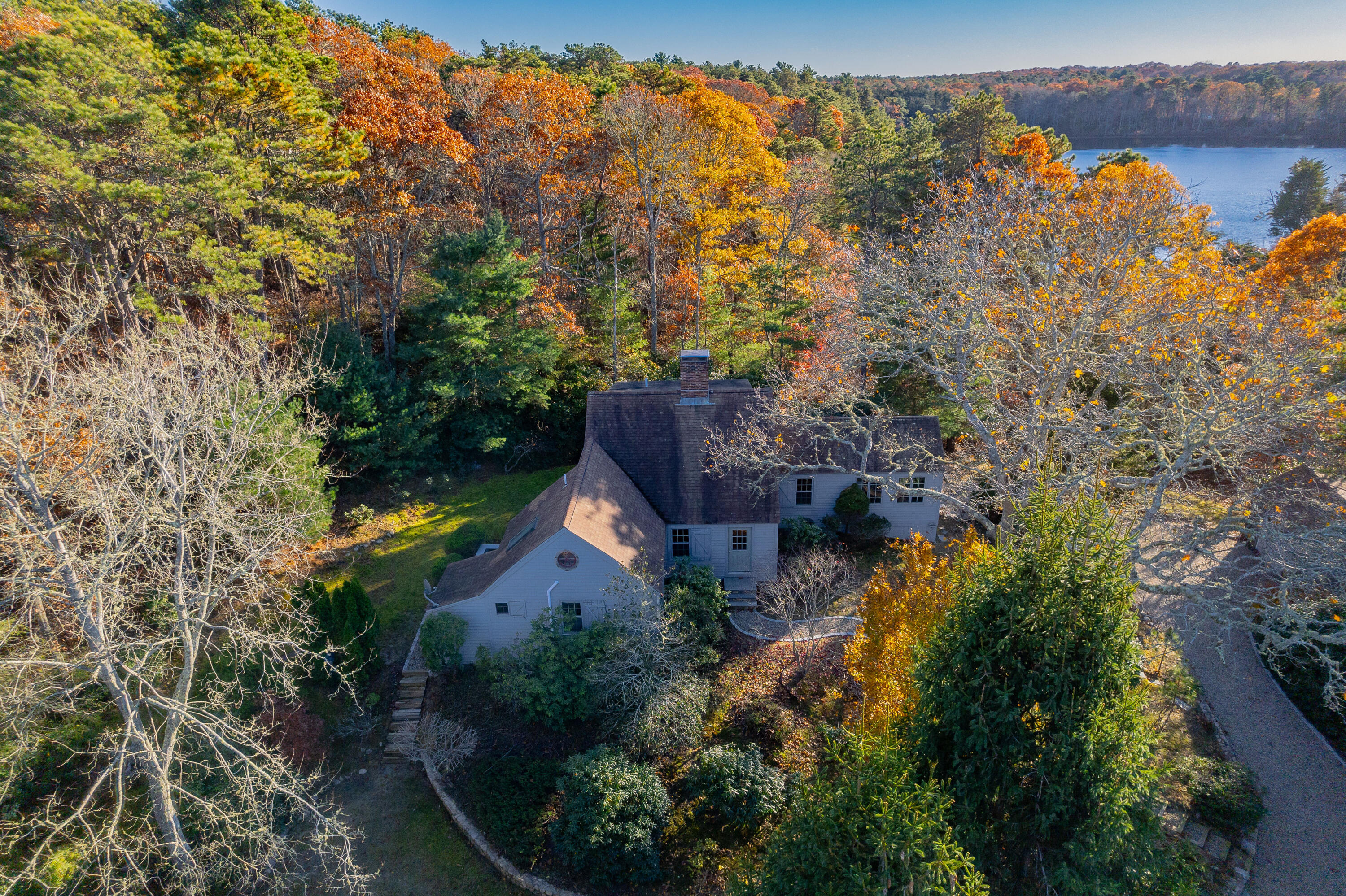 523 Bumps River Road Osterville, MA 02655 - Photo 2 of 49 an aerial view of house with yard and mountain view in back