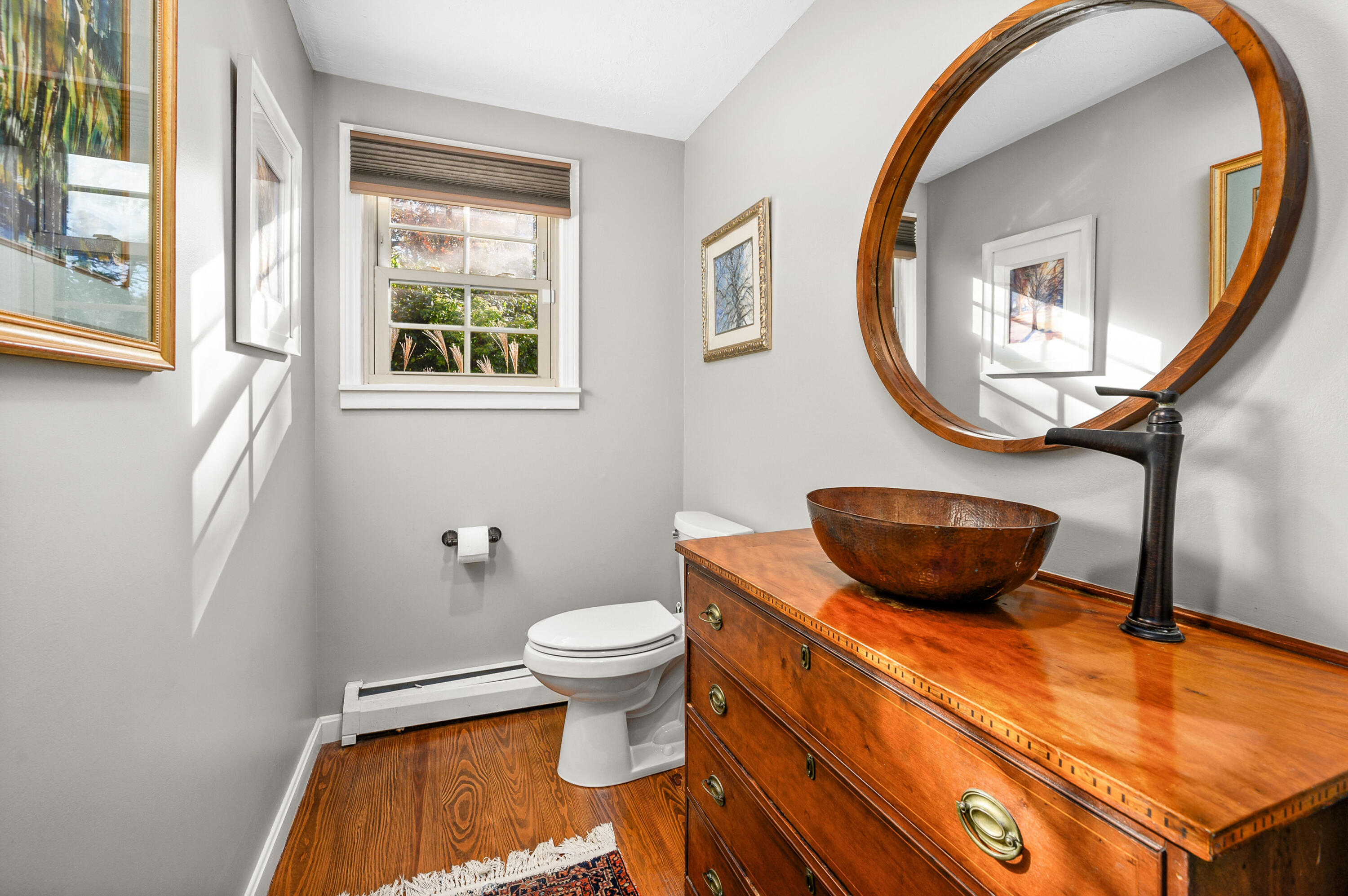 523 Bumps River Road Osterville, MA 02655 - Photo 25 of 49 a bathroom with a toilet sink and mirror