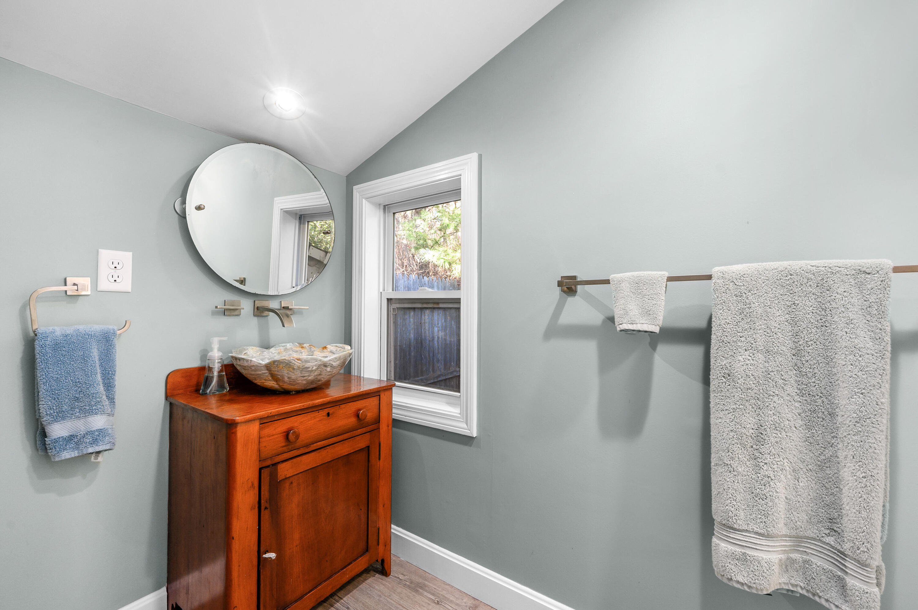 523 Bumps River Road Osterville, MA 02655 - Photo 42 of 49 a bathroom with a sink and a mirror