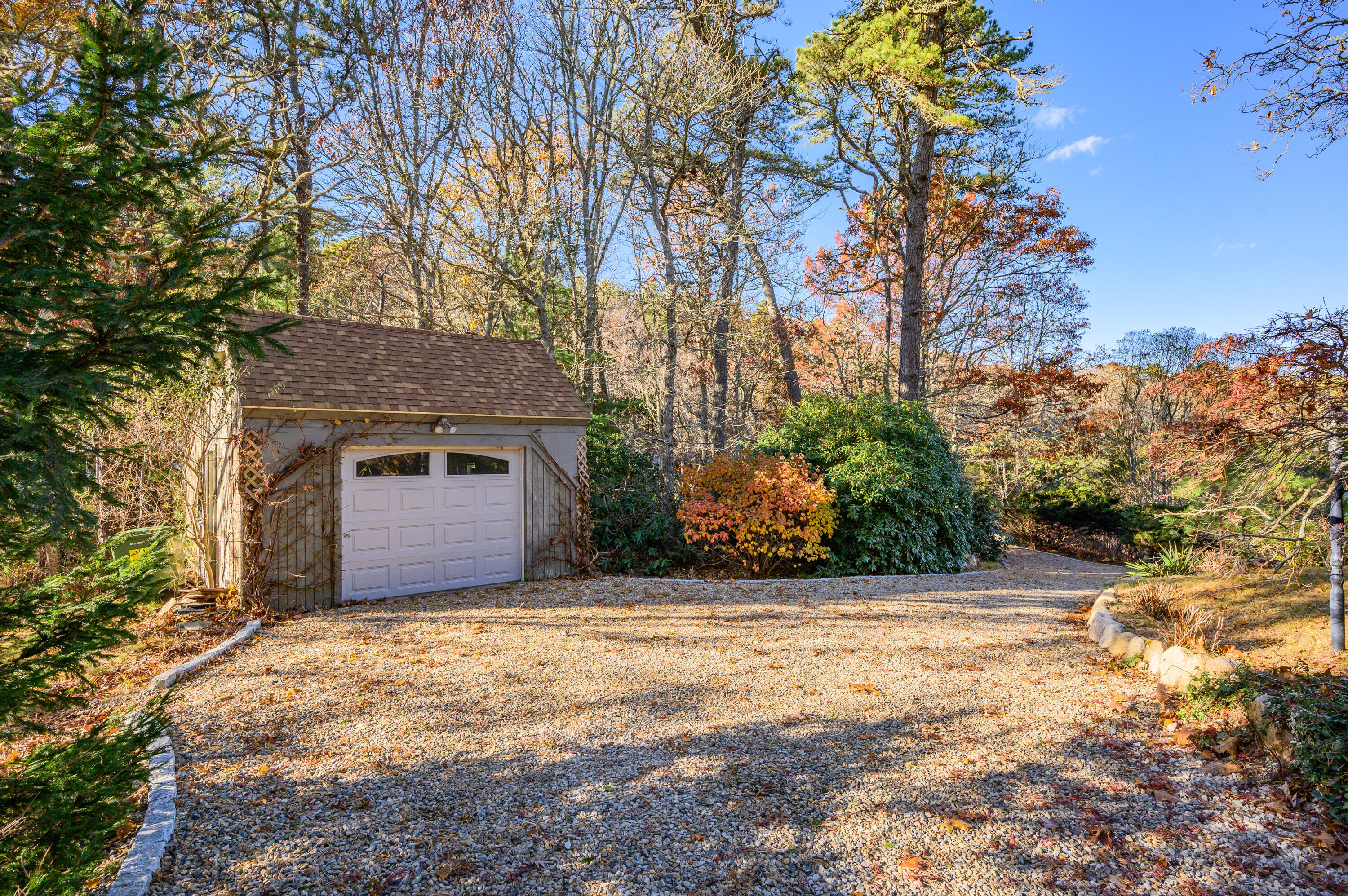 523 Bumps River Road Osterville, MA 02655 - Photo 43 of 49 a front view of a house with yard and trees