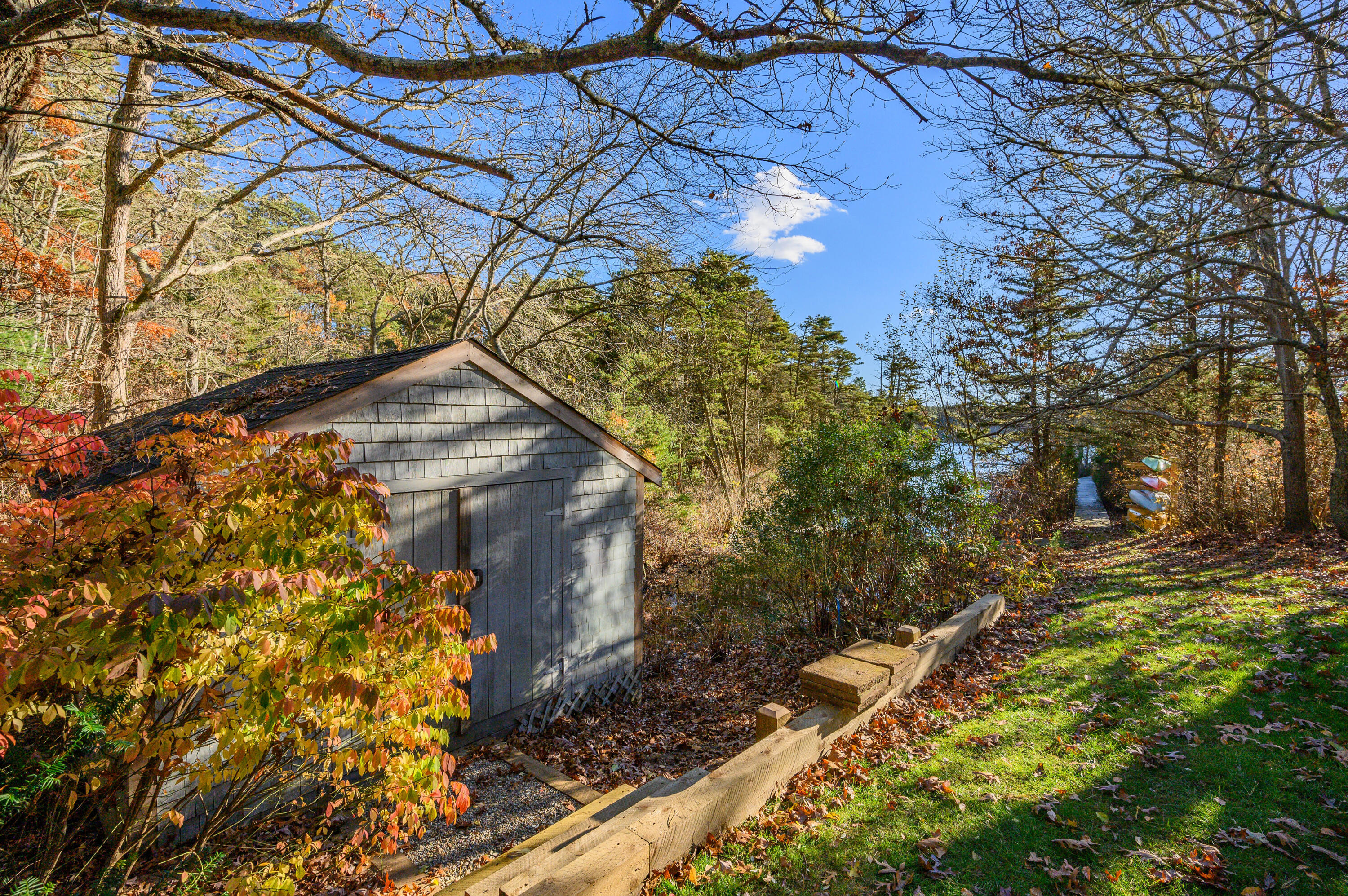 523 Bumps River Road Osterville, MA 02655 - Photo 44 of 49 a backyard of a house with lots of green space