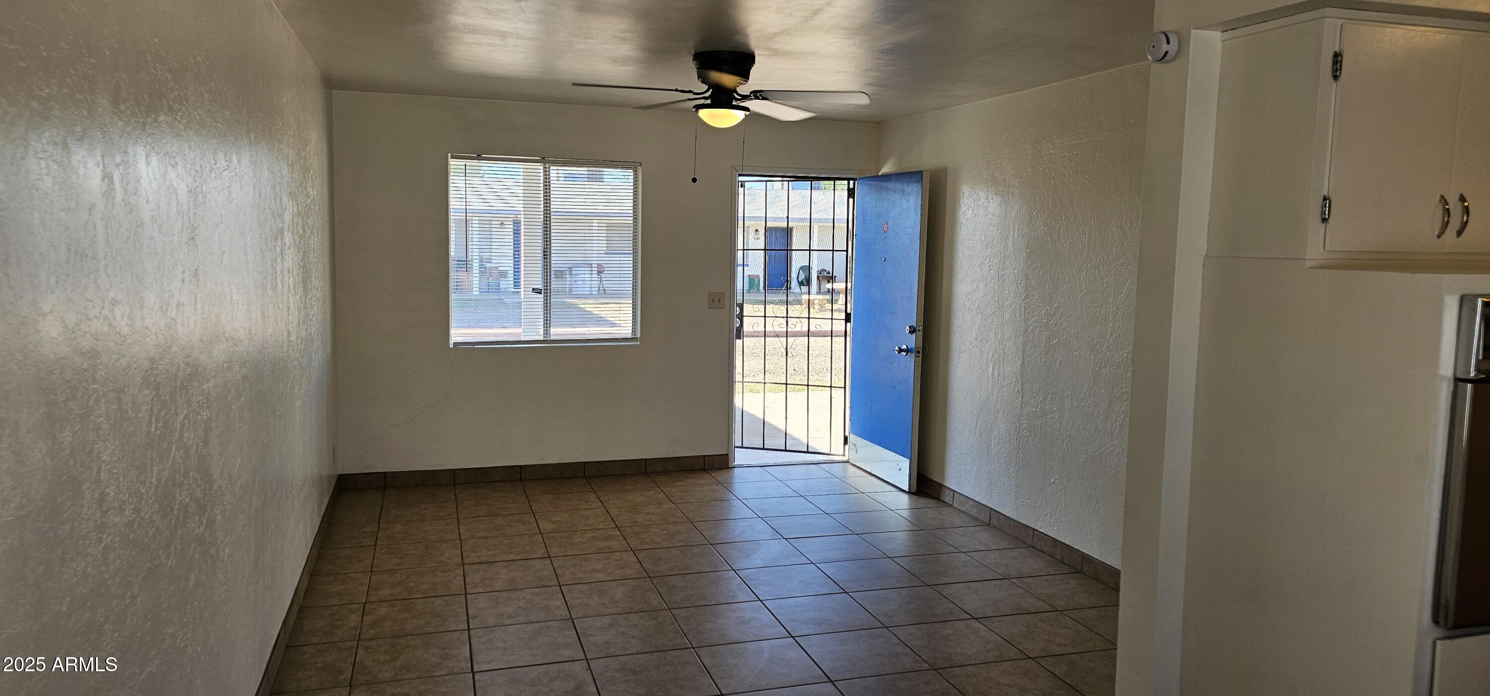 62 South Allen, Unit A Mesa, AZ 85204 - Photo 1 of 15 a view of an empty room with a window