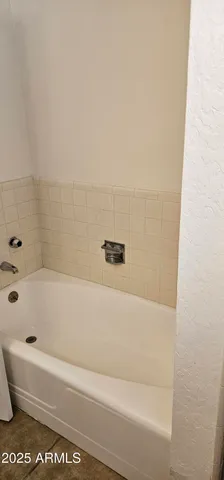 a bathroom with a bathtub