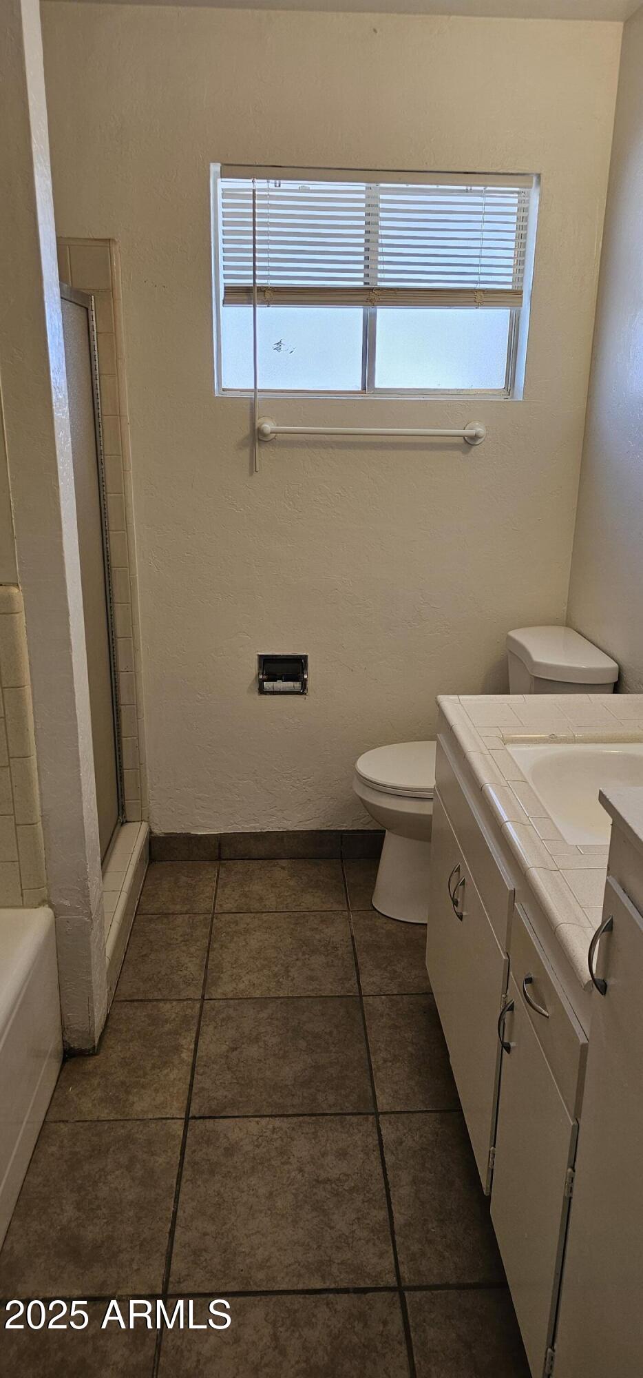 62 South Allen, Unit A Mesa, AZ 85204 - Photo 14 of 15 a bathroom with a sink and a toilet