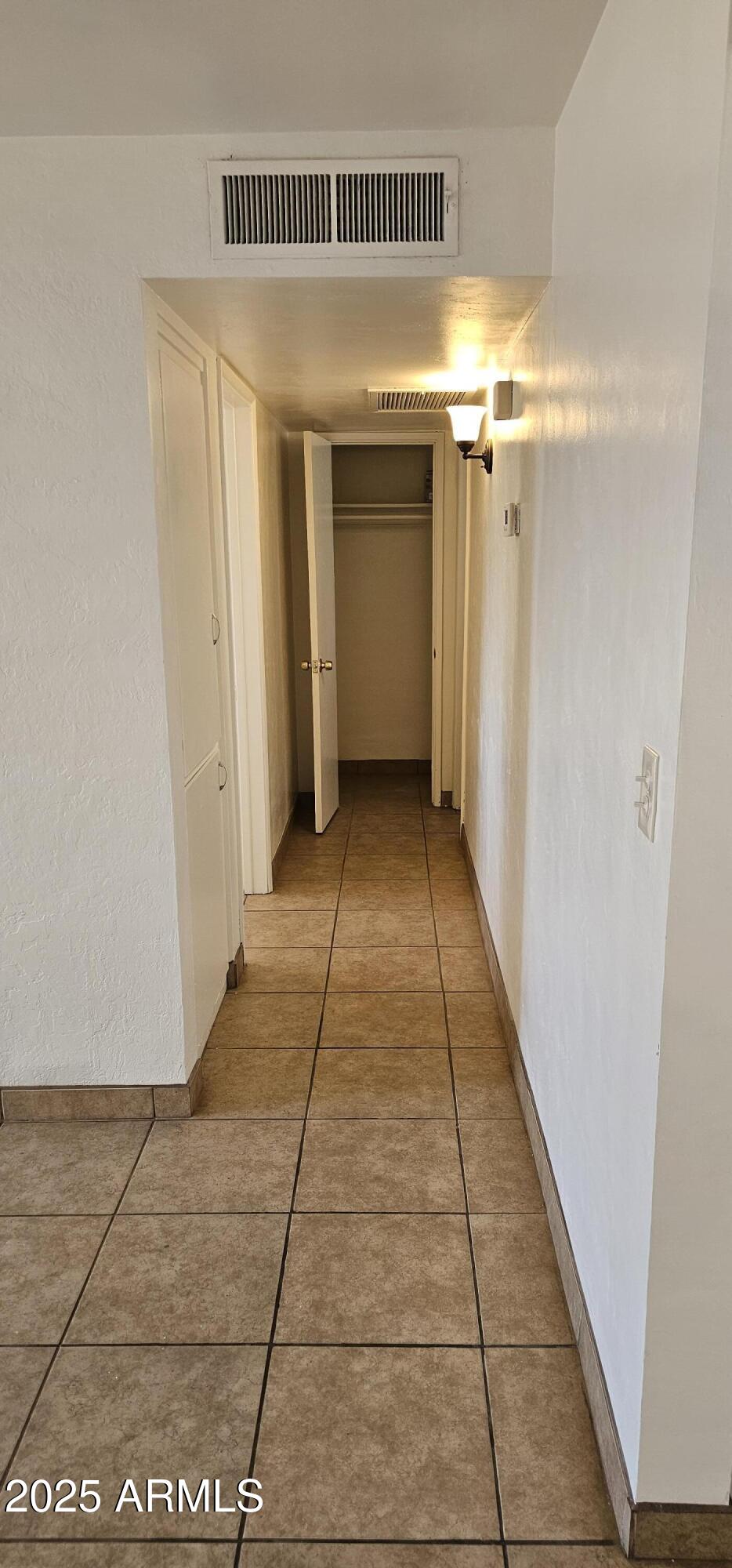 62 South Allen, Unit A Mesa, AZ 85204 - Photo 8 of 15 a view of hallway with a window and a mirror