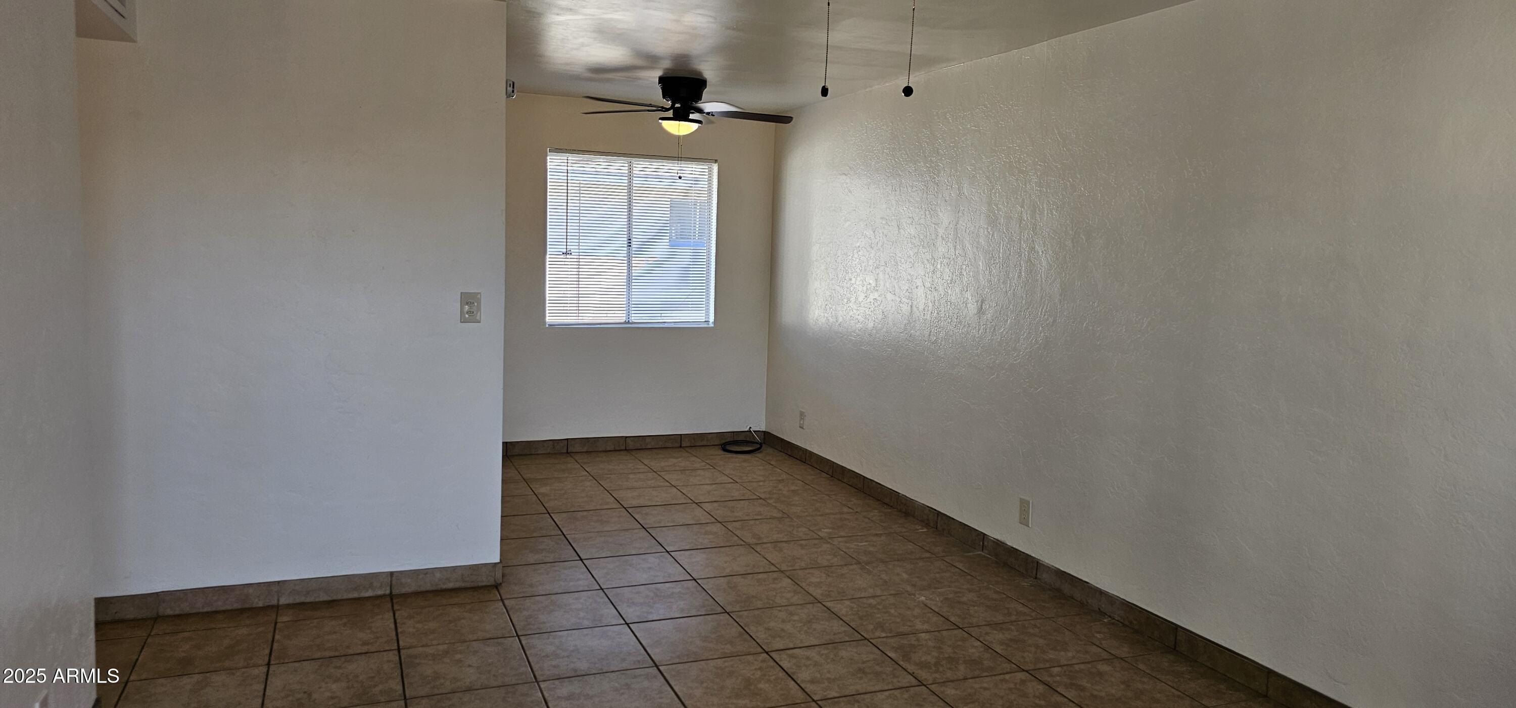 62 South Allen, Unit A Mesa, AZ 85204 - Photo 10 of 15 a view of an empty room with a window