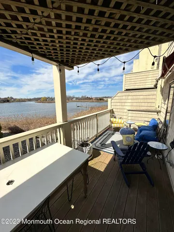 a view of a balcony with chairs
