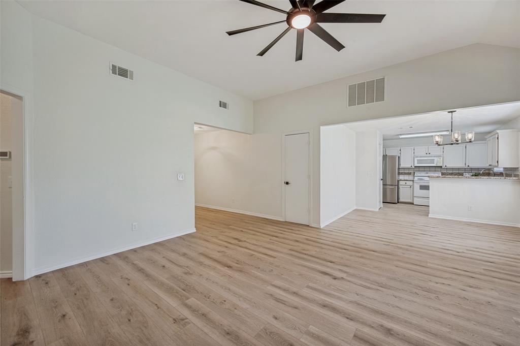 629 Concho Drive Oak Point, TX 75068 - Photo 16 of 35 a view of empty room with wooden floor and window