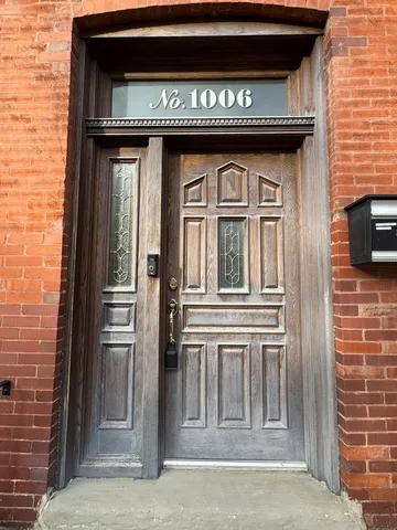 a view of a wooden door of the house