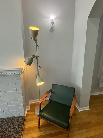 a living room with a couch and a potted plant