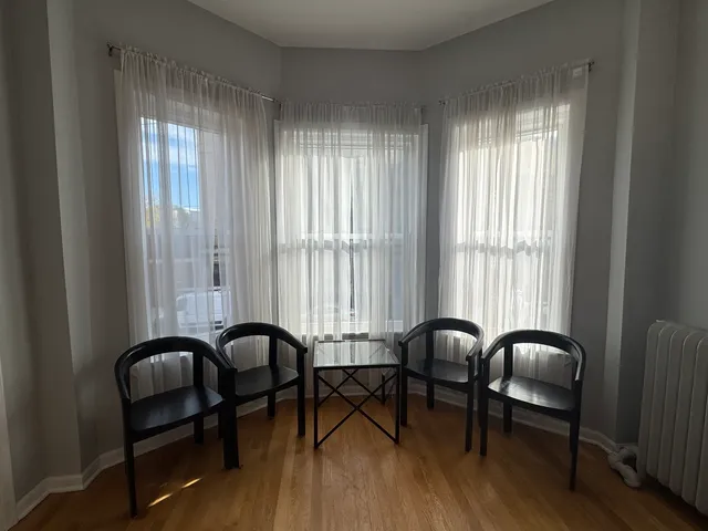 a view of a livingroom with furniture and window
