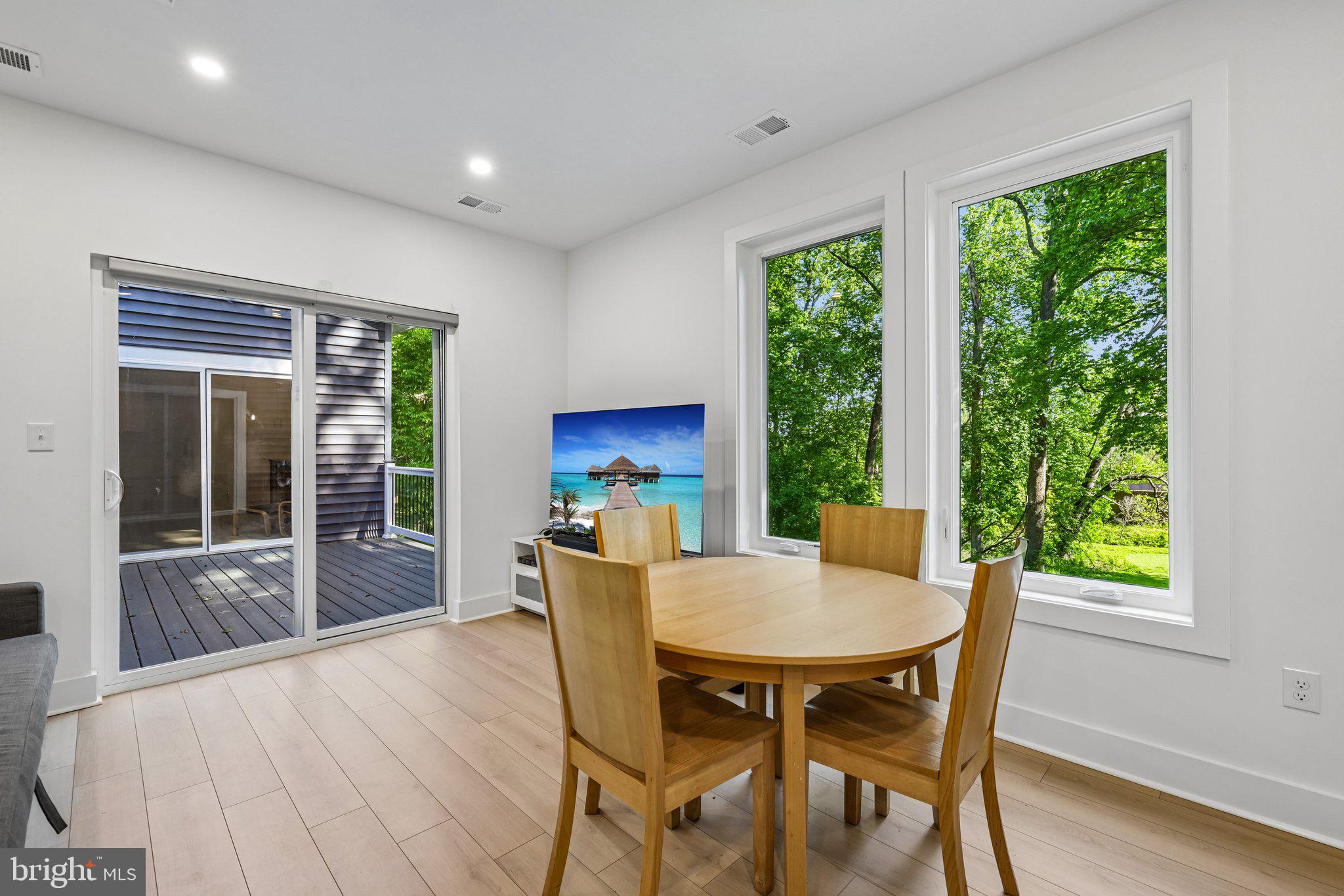 4315 Pinetree Road Rockville, MD 20853 - Photo 10 of 28 a view of a dining room with furniture window and wooden floor