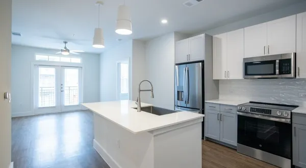 a kitchen with a stove and a microwave