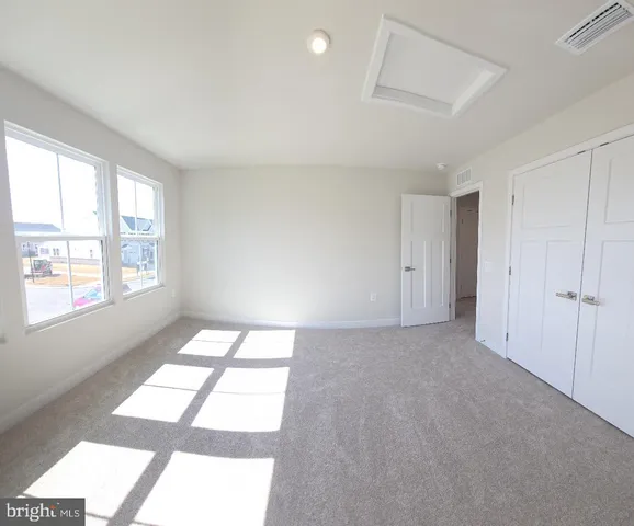 a view of an empty room and window