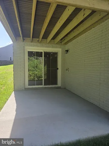 a view of a room with a large window